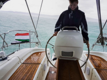 Andras Nemeth at the wheel of a yacht